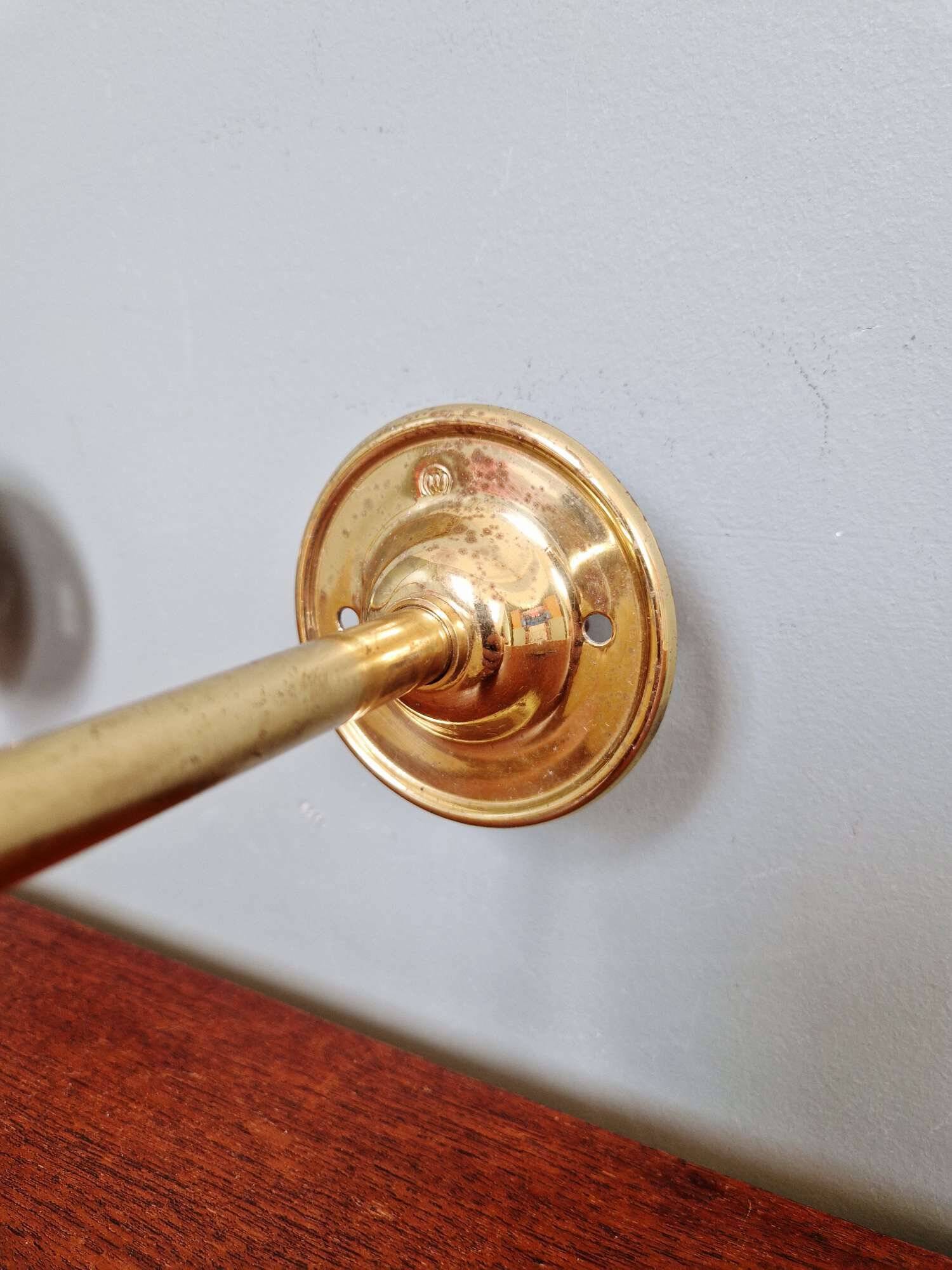 Pair of brass and yellow/white speckled glass wall sconces