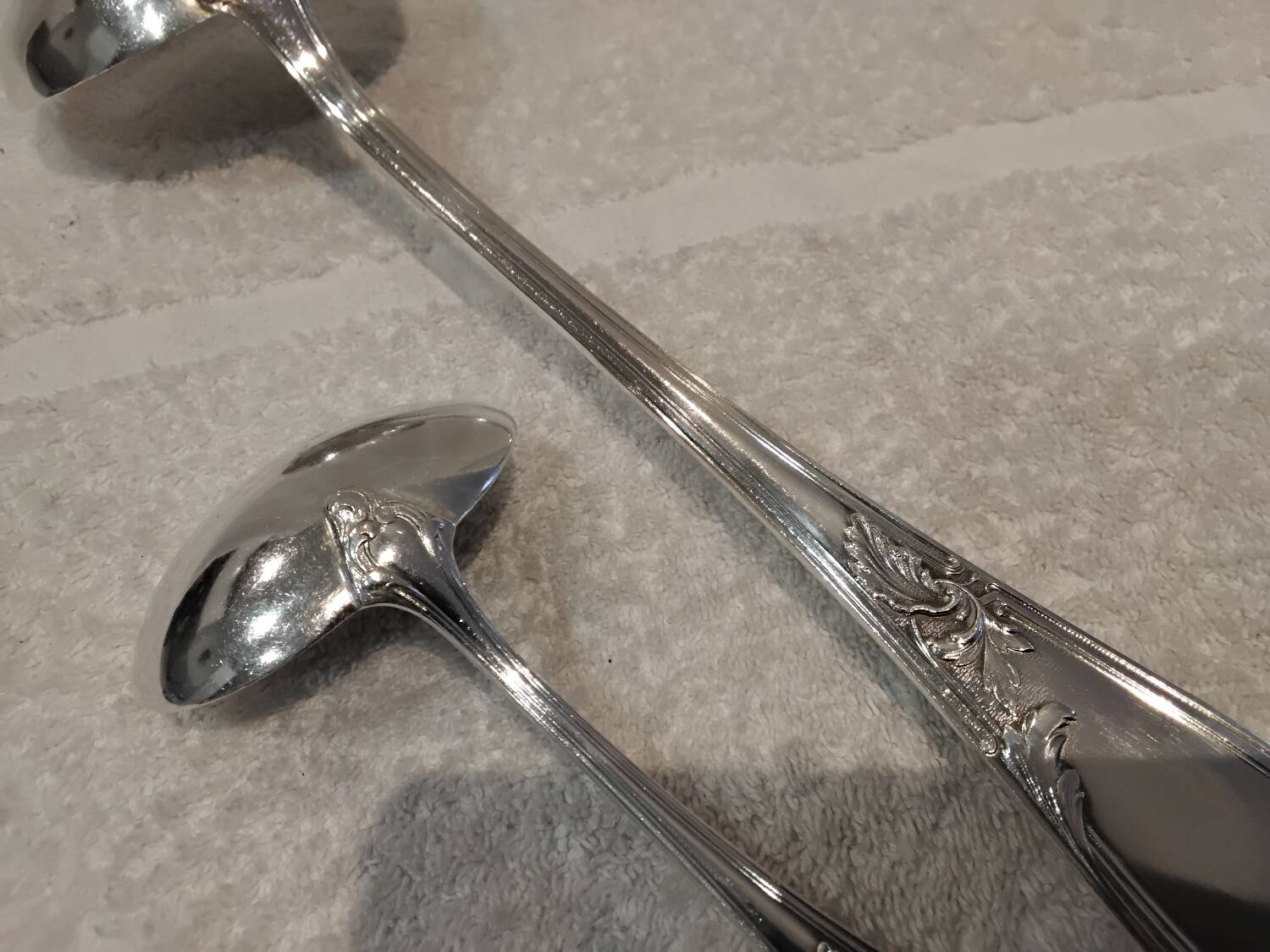 2 Silver-plated soup and sauce ladles with rocaille ribbon decoration