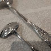 2 Silver-plated soup and sauce ladles with rocaille ribbon decoration