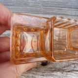 Glass condiment service in transparent pink moulded glass.