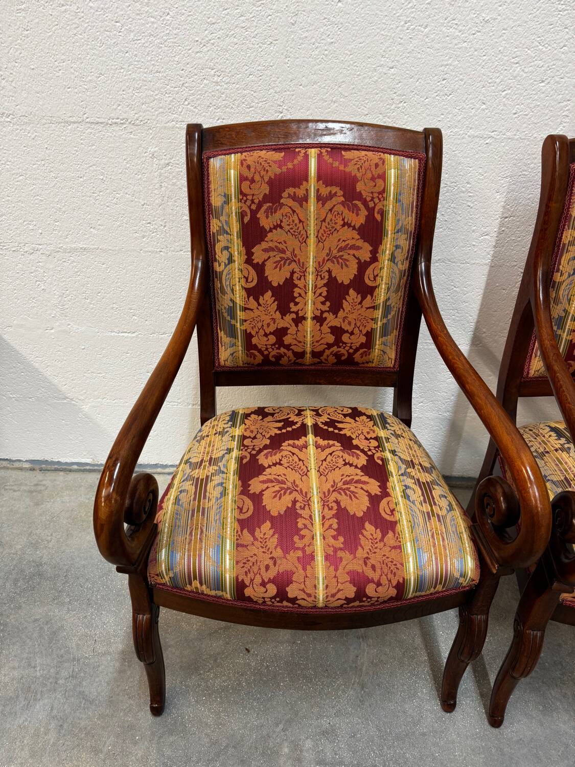 Pair of cross-back armchairs, Empire style, 19th century.