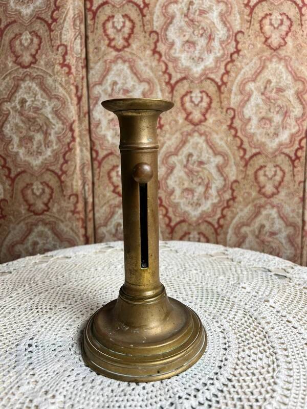 Patinated gilt brass candlestick
