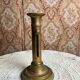 Patinated gilt brass candlestick