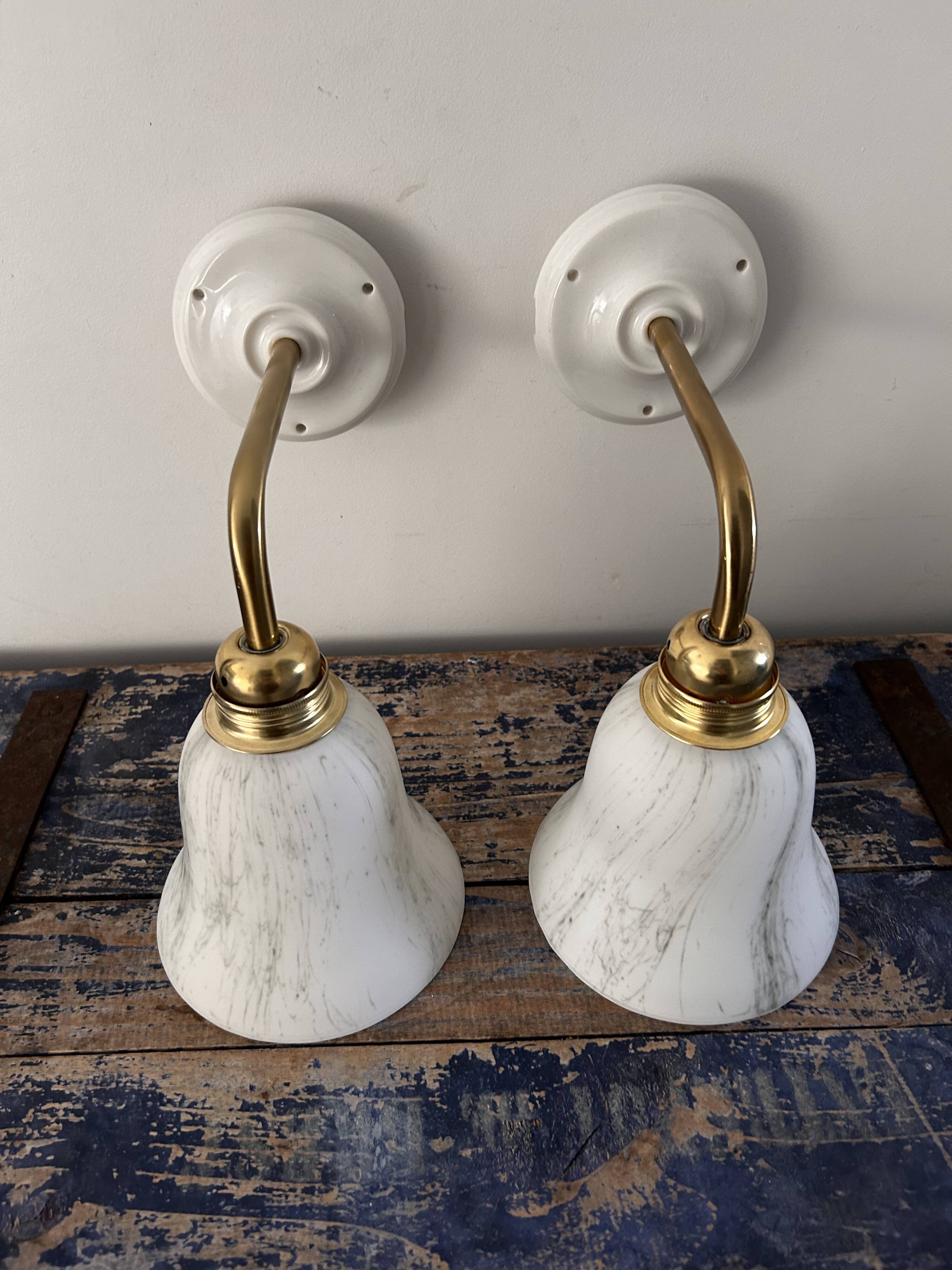 Pair of brass and opaline wall lights