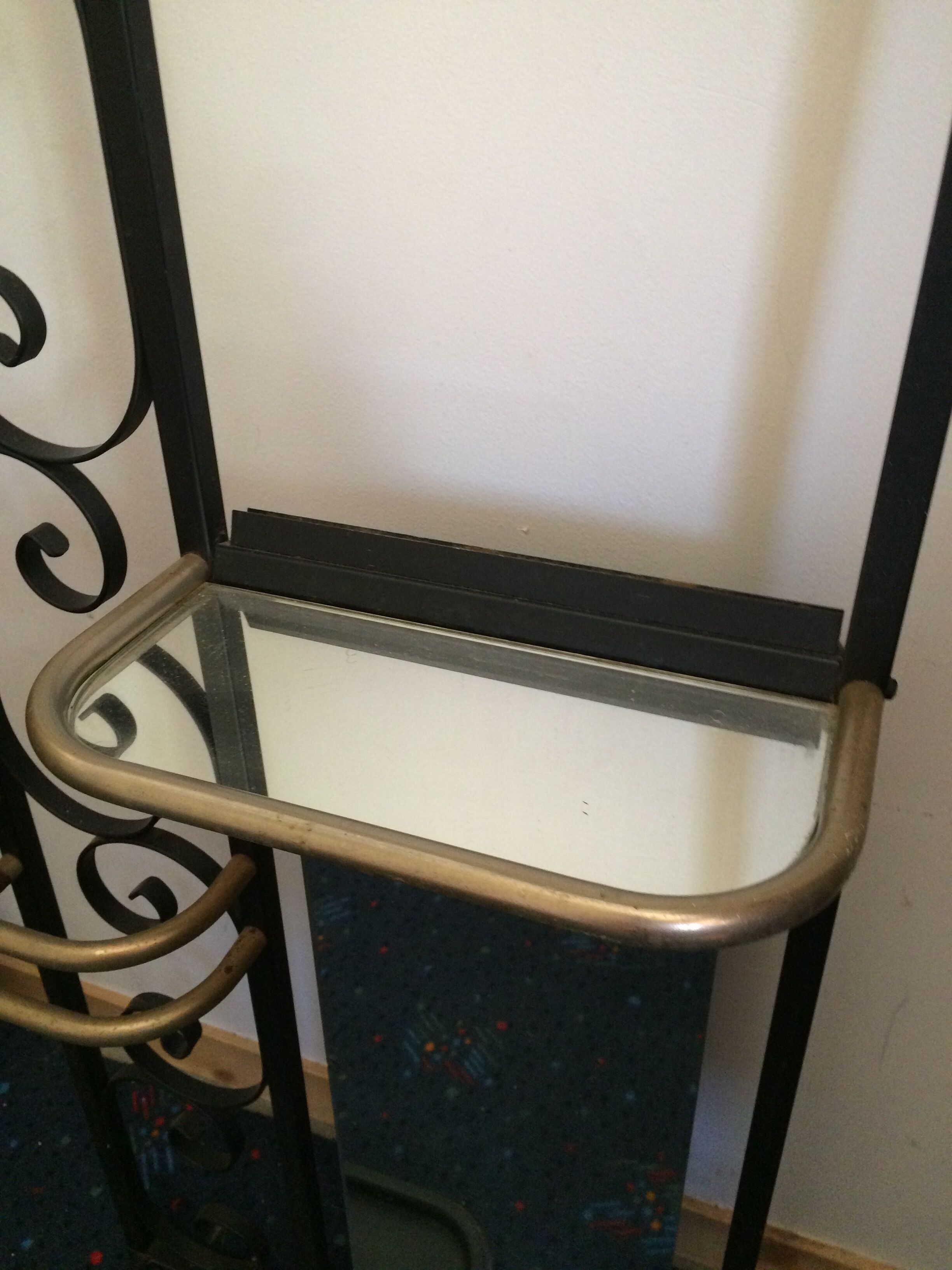 Coat hanger on wrought iron feet