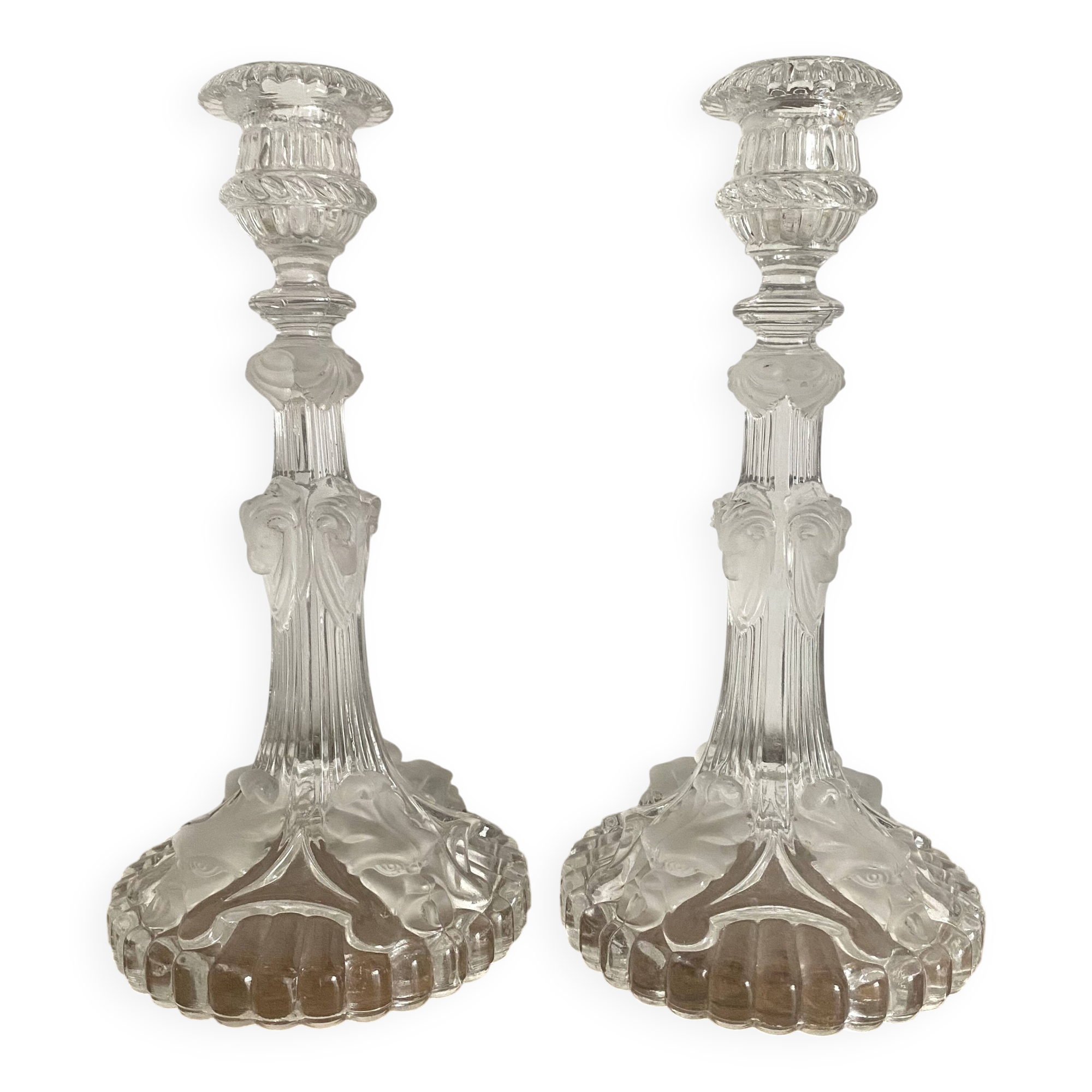 Pair of moulded glass candlesticks, ram heads and masks