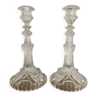 Pair of moulded glass candlesticks, ram heads and masks