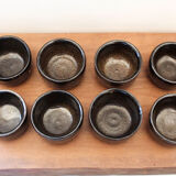 Set of 8 black ceramic cups signed
