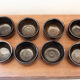 Set of 8 black ceramic cups signed