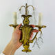Bronze wall light with rococo style Louis XV pendants.
