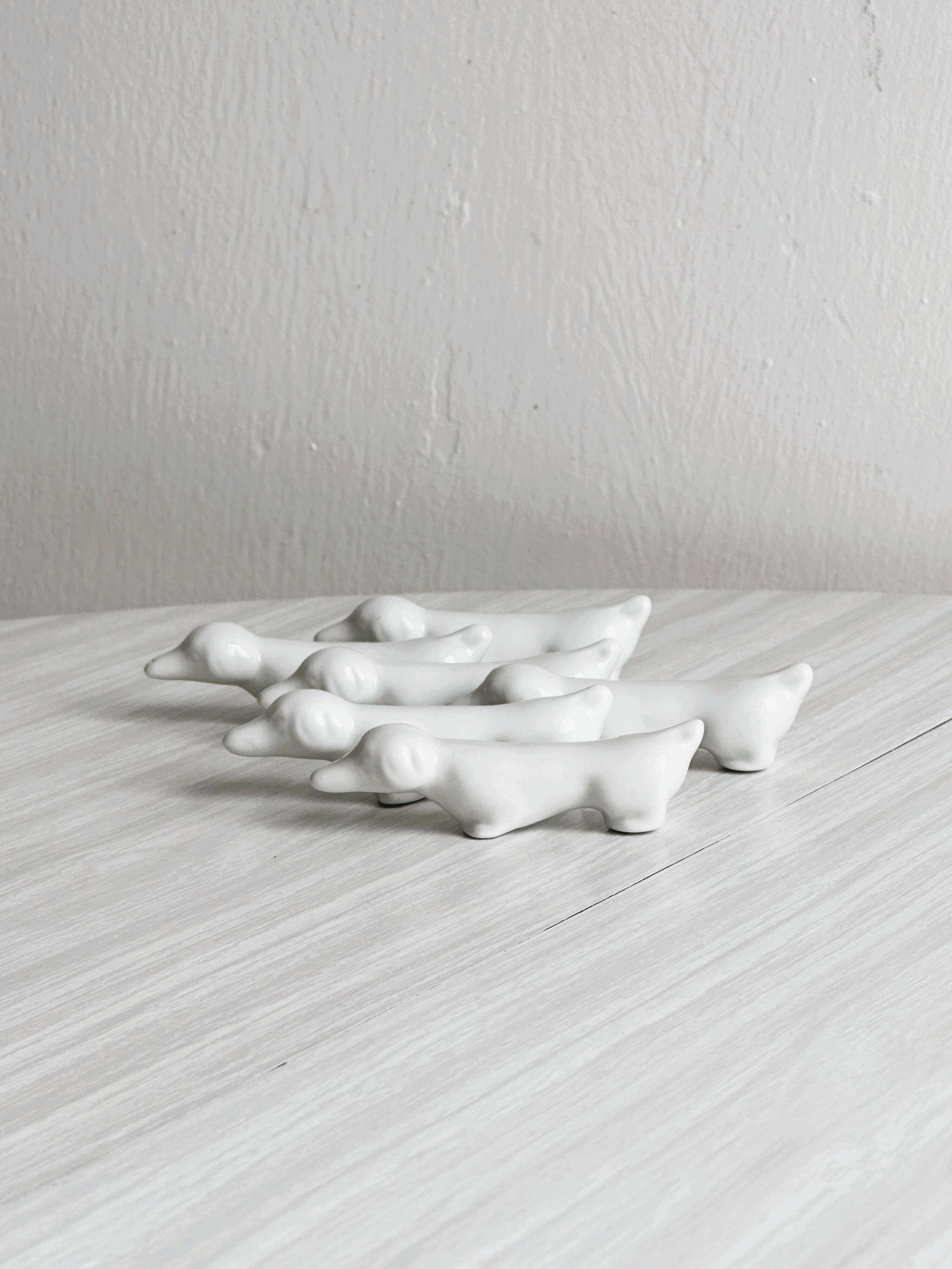 6 vintage white porcelain knife rests