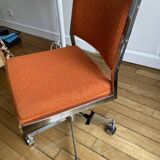 Orange office chair in 70s style