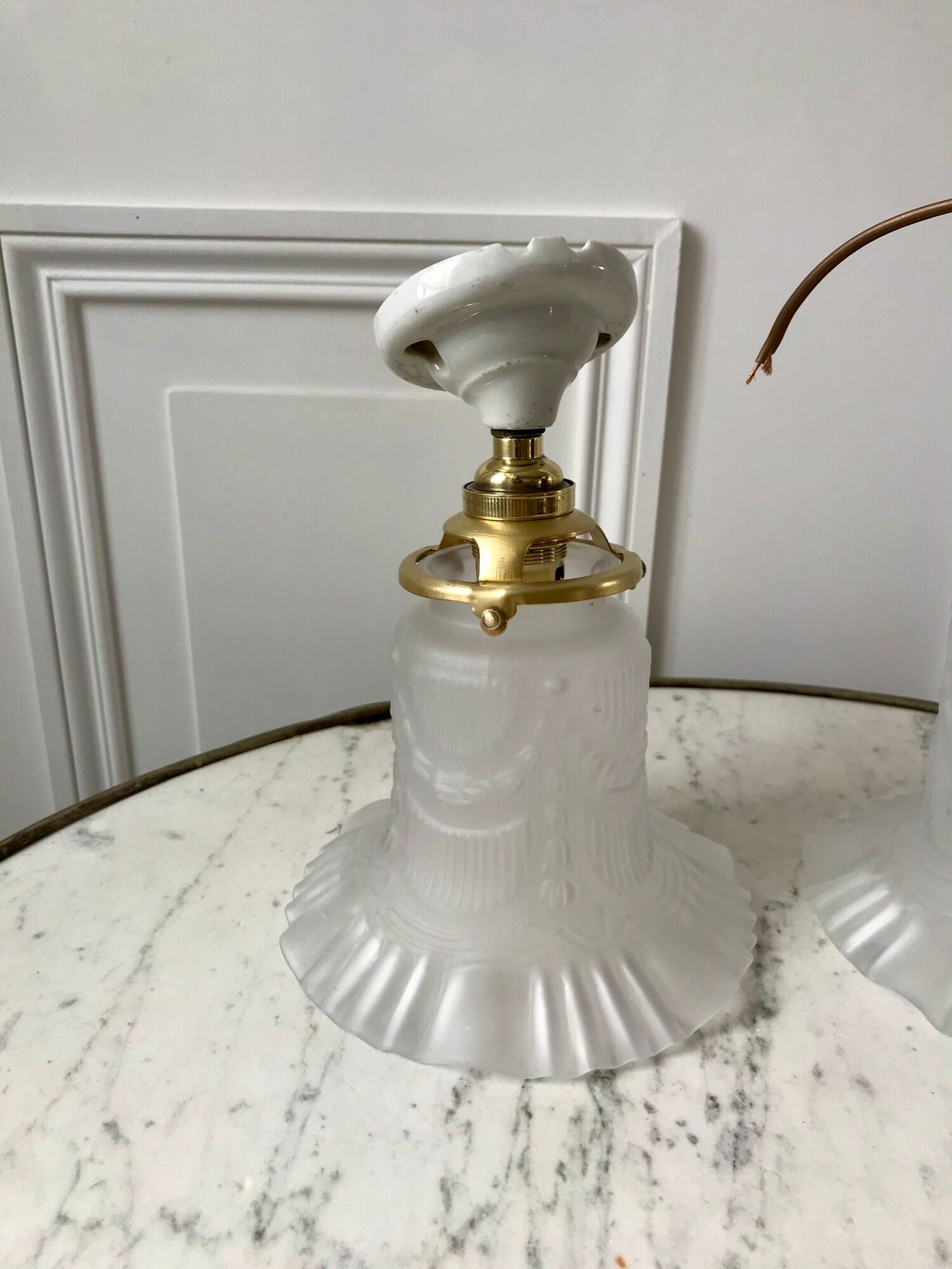 Pair of tulip wall lamps in molded glass on porcelain support 20s