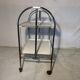 Vintage folding dessert table in chrome metal with enamelled trays.