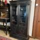Blackened wooden display cabinet from the late 19th or early 20th century.