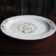 Old large oval serving dish in Moustiers earthenware.