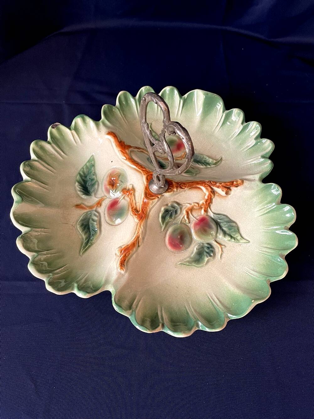 Beggar or servant in barbotine with fruit decoration heart handle