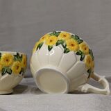 Sunflower flower cups and milk jug