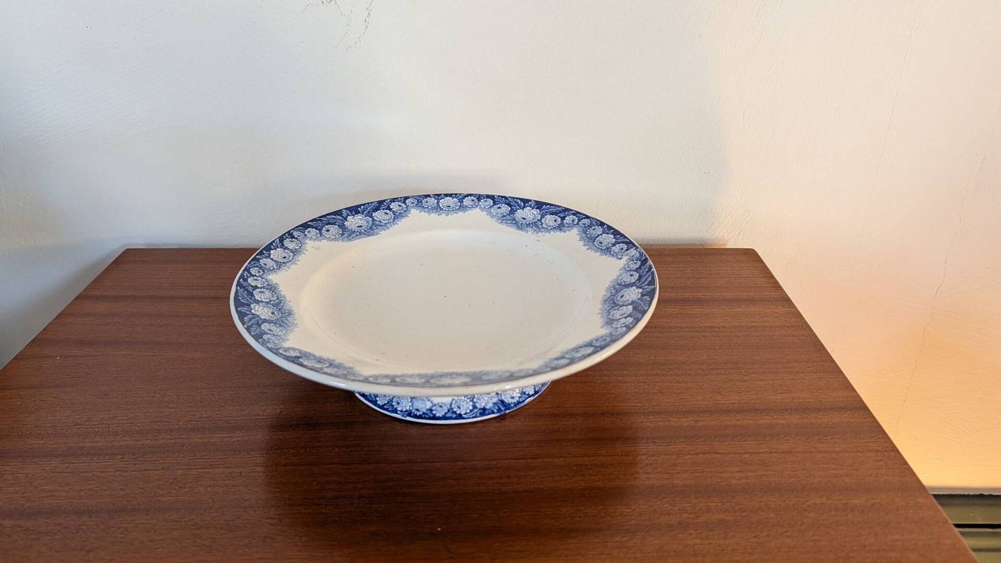 Antique compote dish with blue floral decoration.