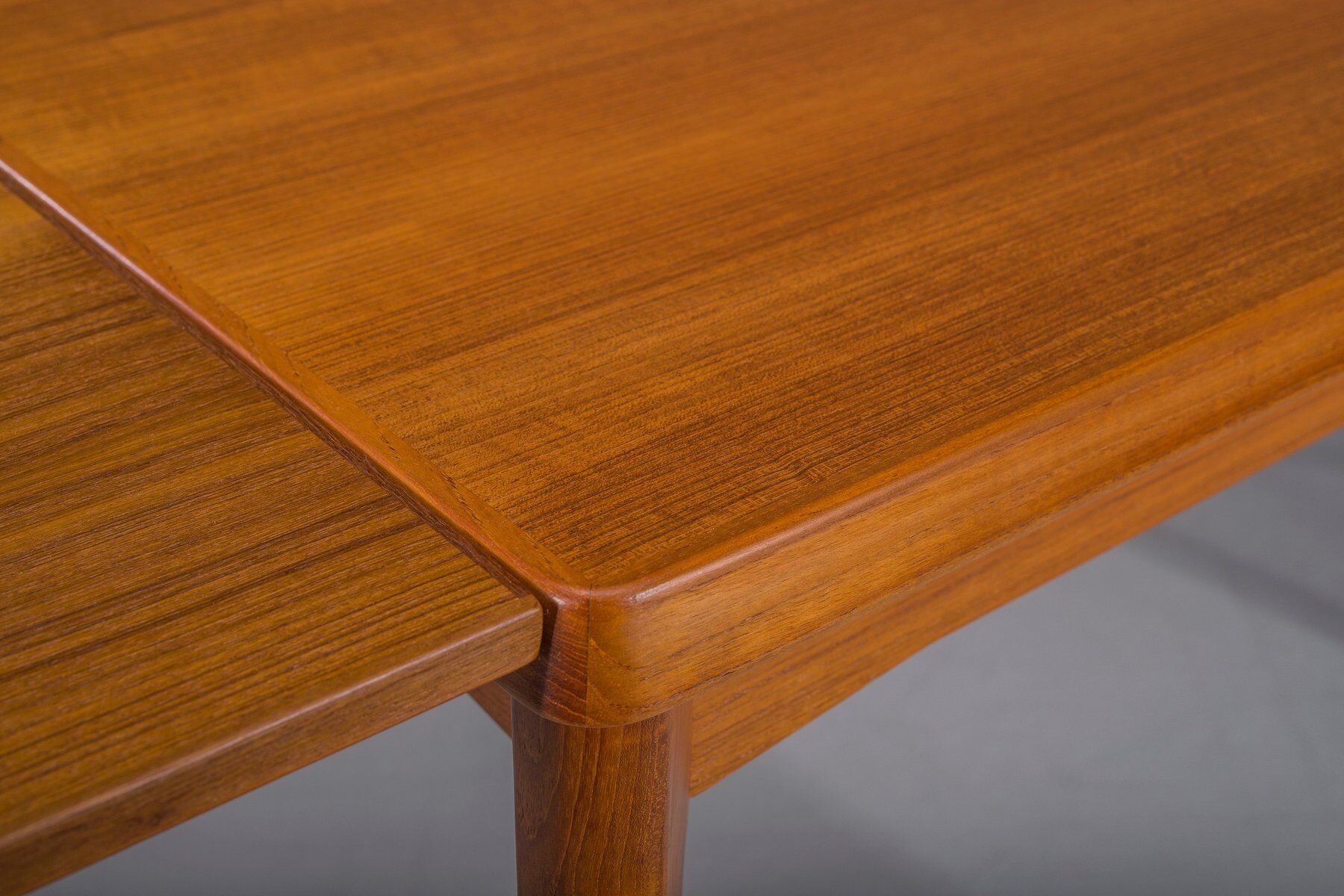 Extendable teak dining table by Henning Kjaernulf for Vejle Stole & Møbelfabrik