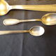 11 silver spoons with punches