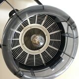 Vintage hairdresser's armchair with helmet transformed into a lamp