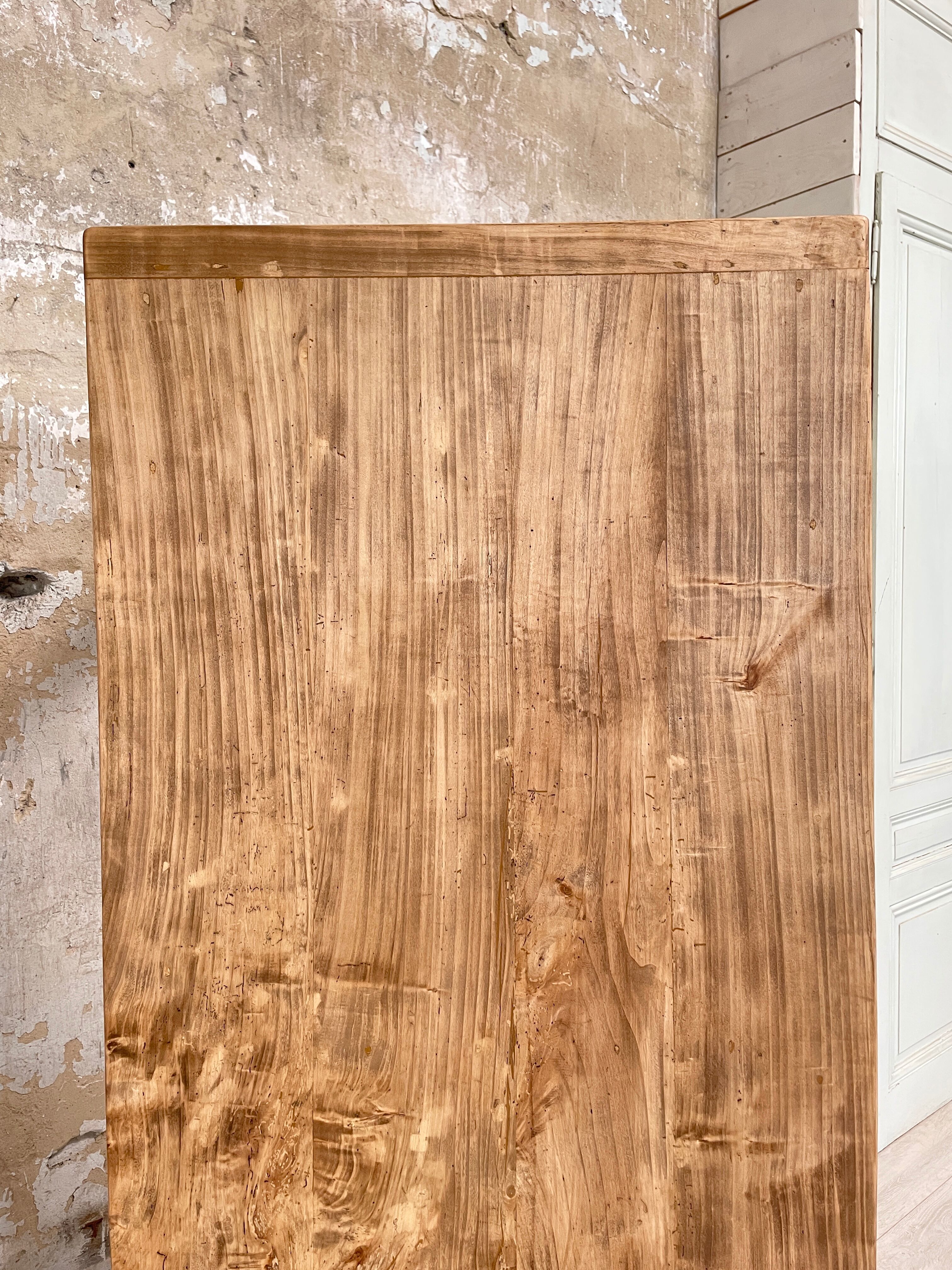 Vintage farmhouse table with turned legs.