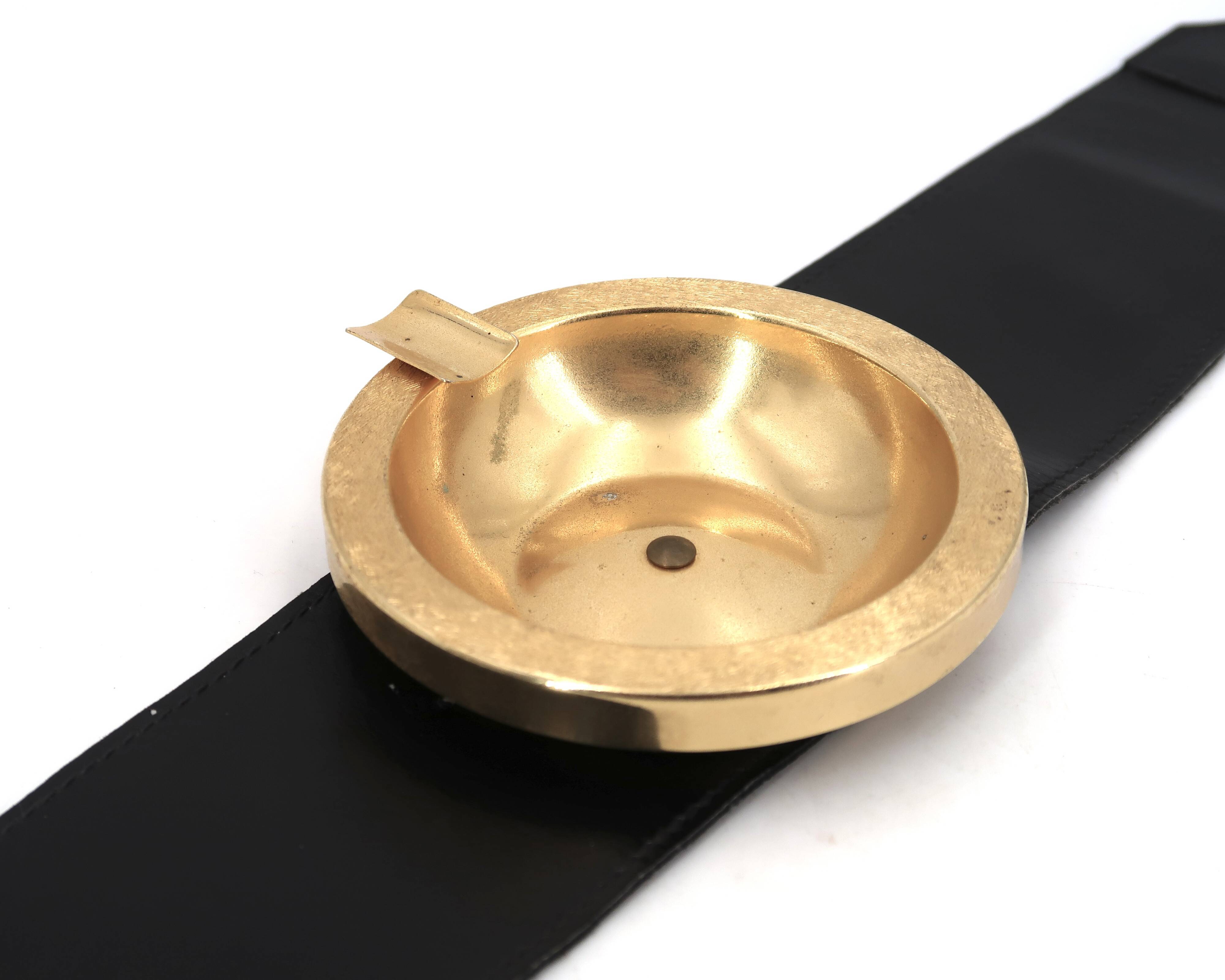 Golden metal armrest ashtray with faux leather and stirrups, 1950s.