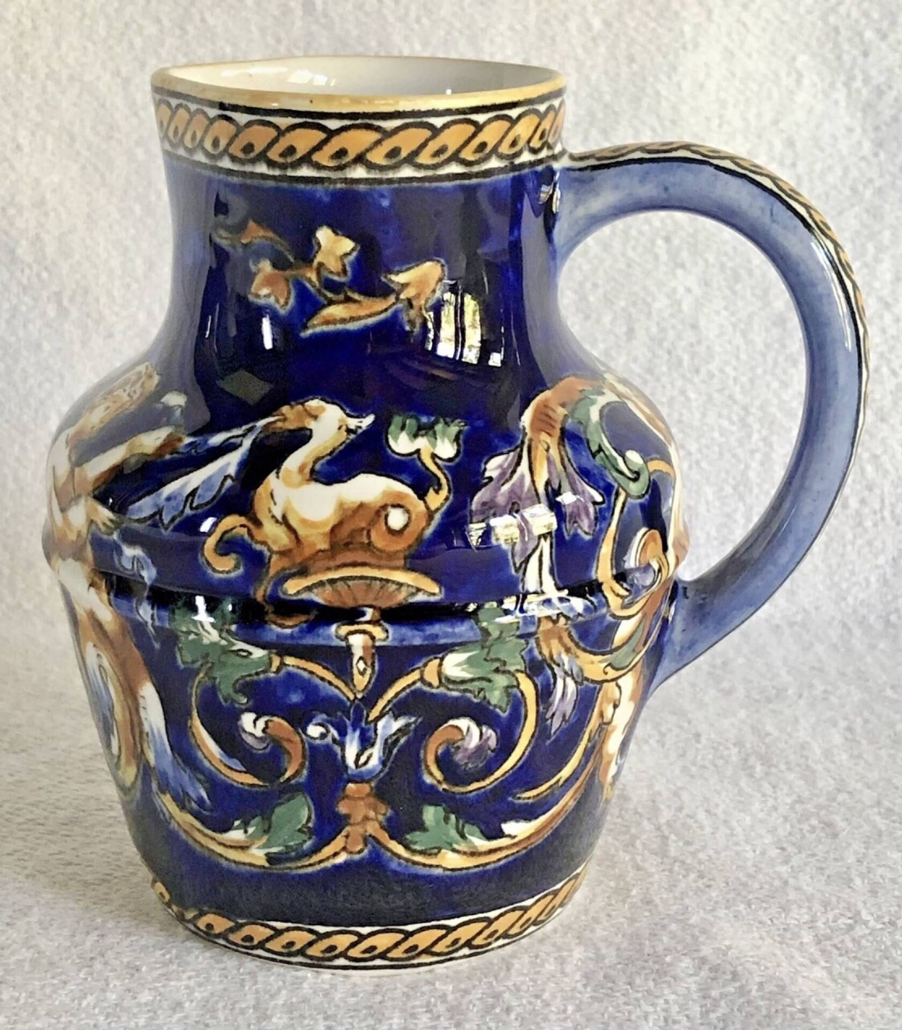 Old cream jug Gien Renaissance blue background 1938/1960