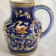 Old cream jug Gien Renaissance blue background 1938/1960