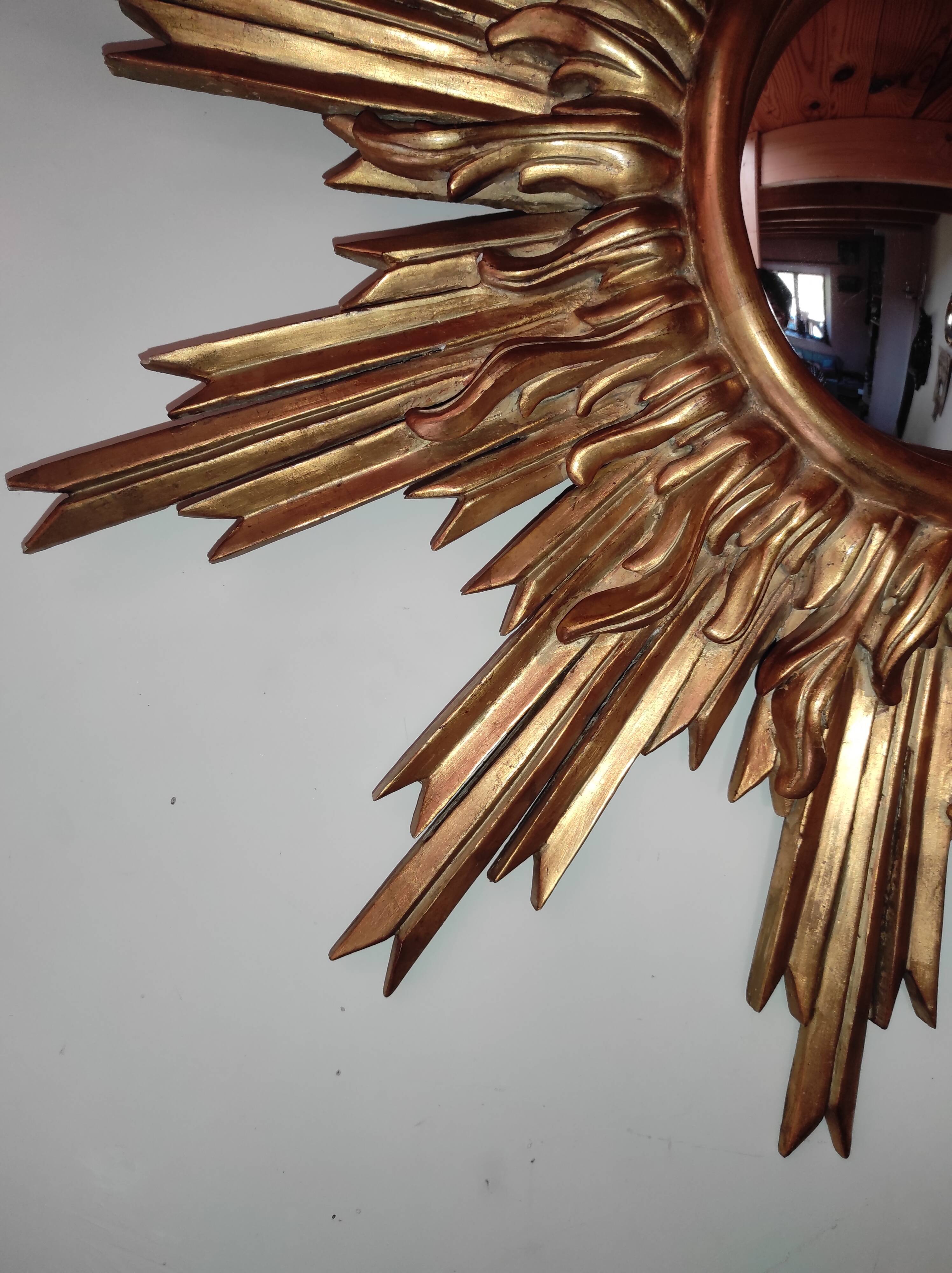 Sun mirror and witch's eye in gilded wood