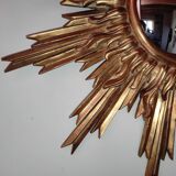 Sun mirror and witch's eye in gilded wood