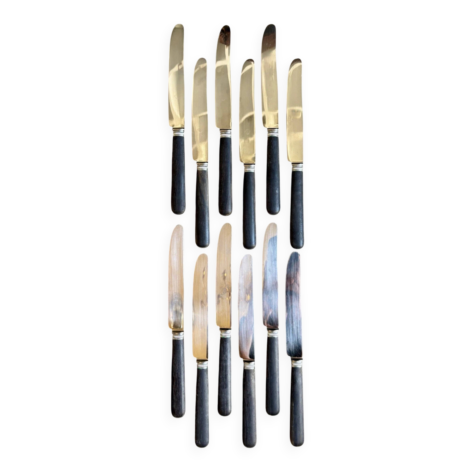 12 blackened wooden knives