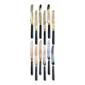 12 blackened wooden knives