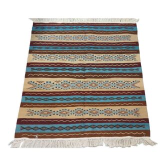 Multicolored hand-woven Berber rugs in natural wool