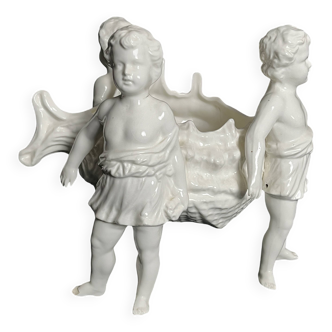 Porcelain, centerpiece with candle holder decorated with putti, 20th century