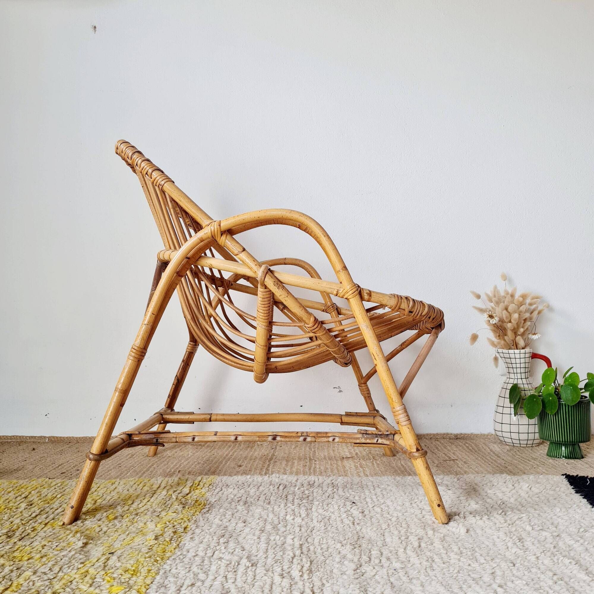 Vintage adult rattan armchair from the 1960s.