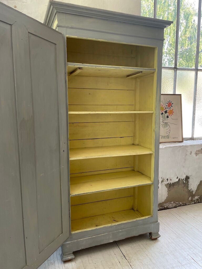 Blue patinated cap cabinet