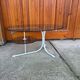 Coffee oval table with metal legs and smoky glass top, 1990s