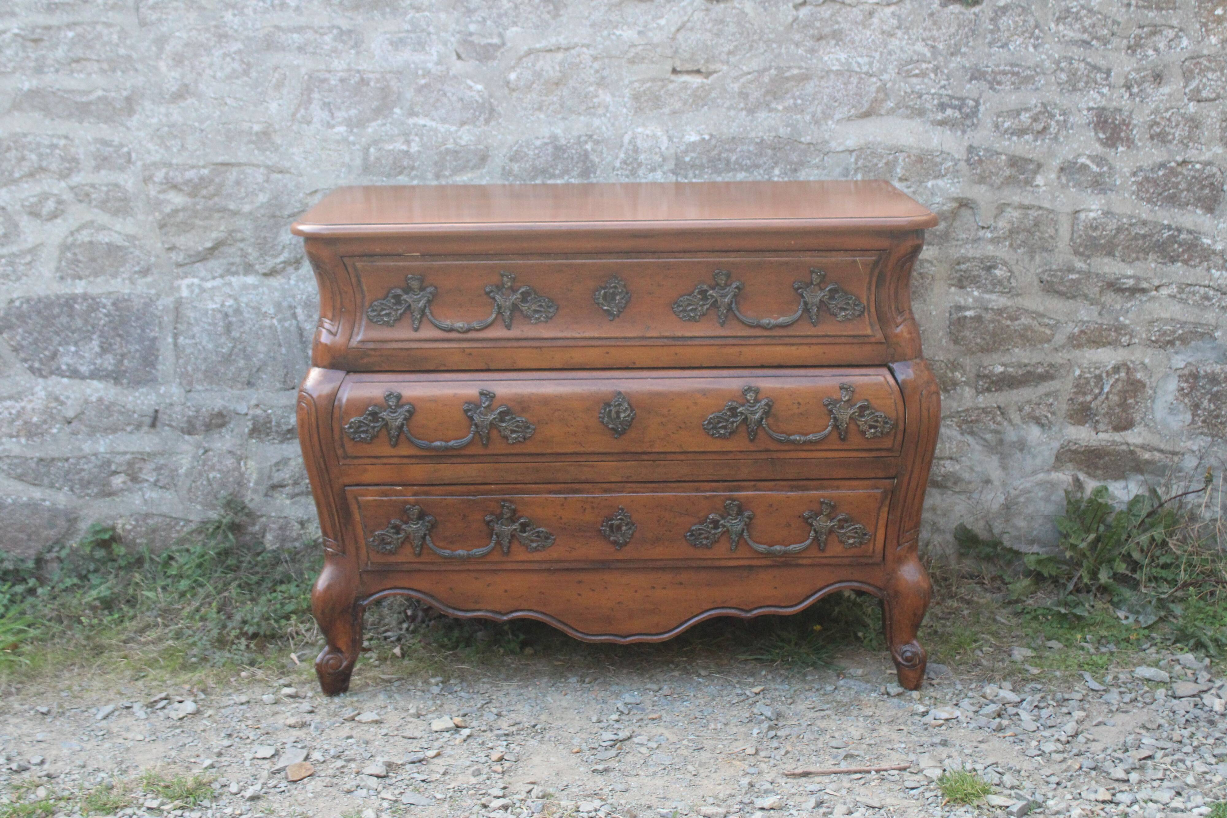 Curved Louis XV style chest of drawers known as a “tomb”