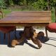 Old walnut table with a central leg.