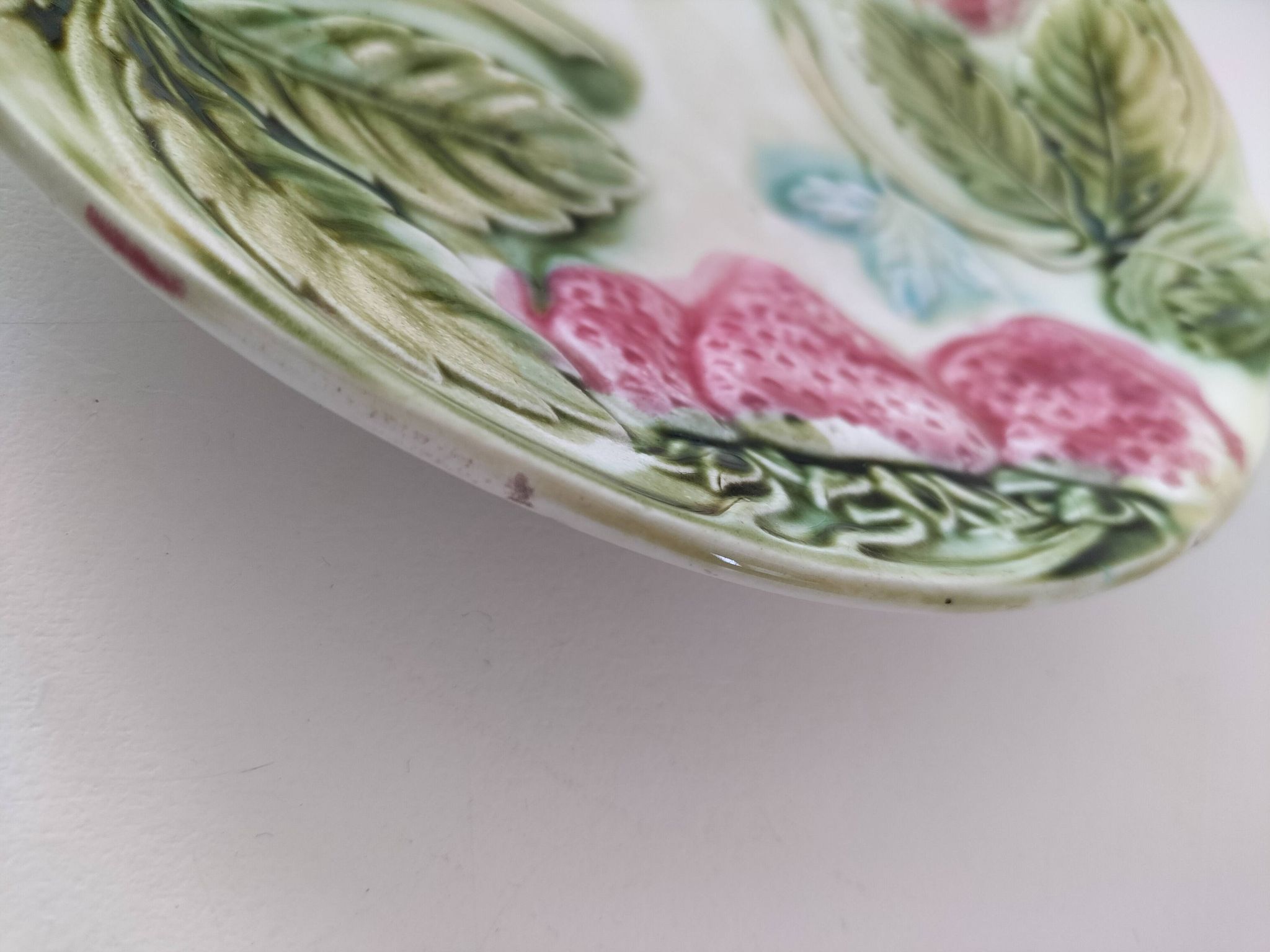 Barbotine plate with strawberries in relief, late 19th and early 20th century