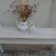 Console with a weathered grey cotton base, top in bleached walnut.
