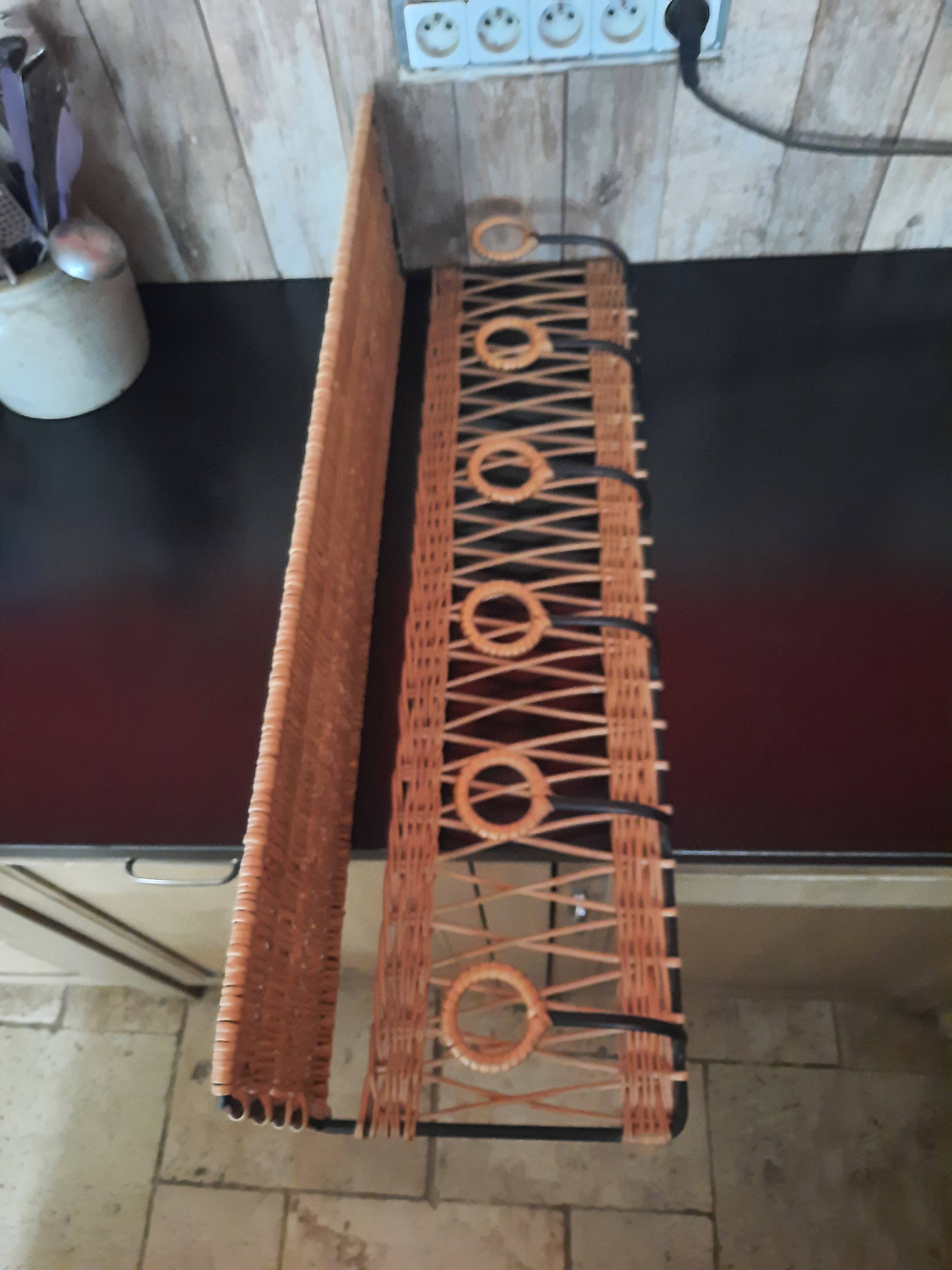 Wicker wall coat holder