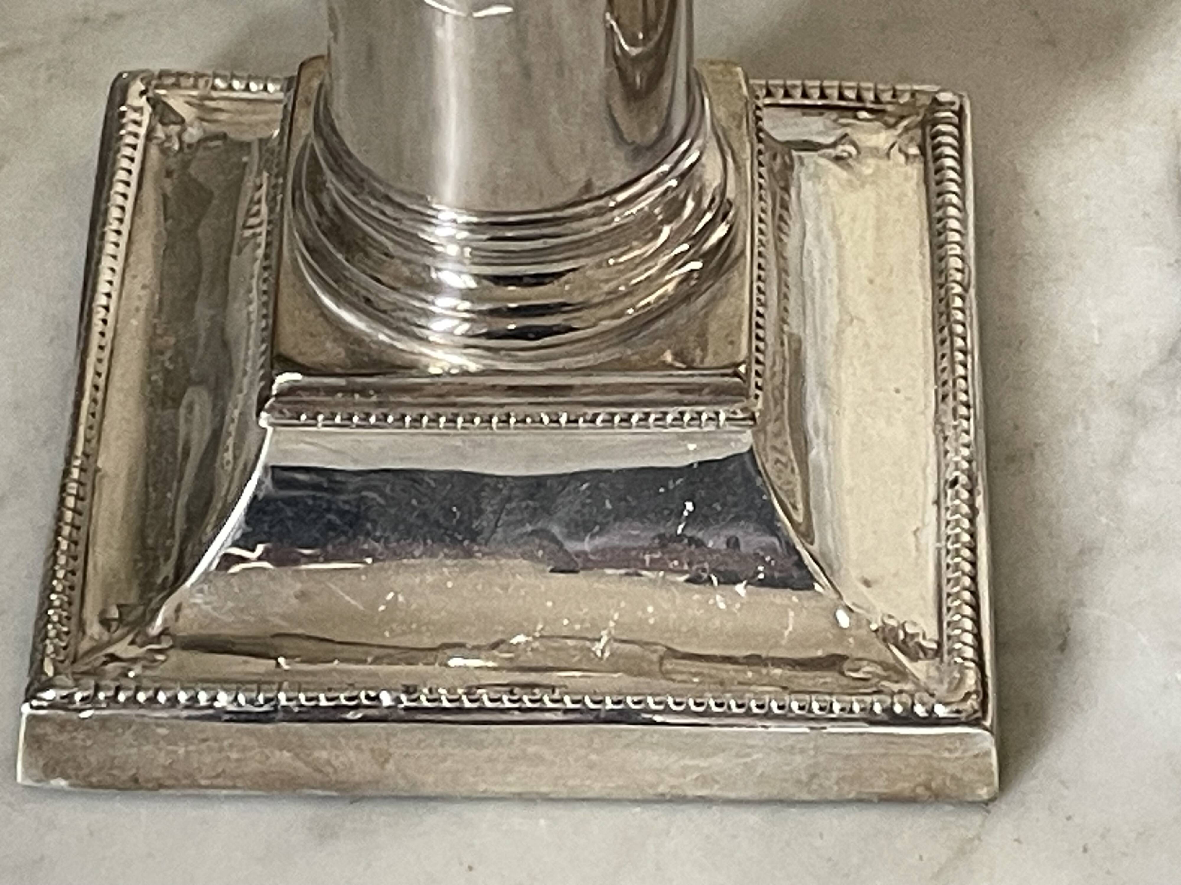 pair of Victorian style silver-plated candlesticks