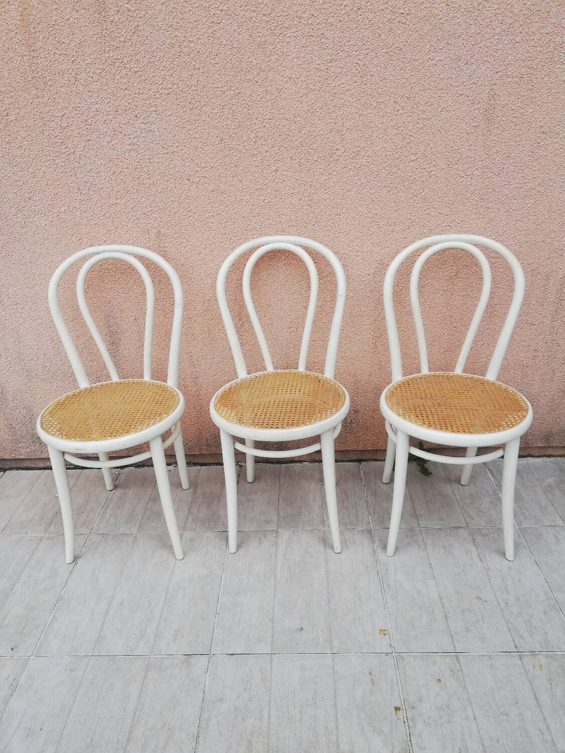 Lot of three Vintage ecru natural cane bistro chairs