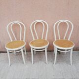 Lot of three Vintage ecru natural cane bistro chairs