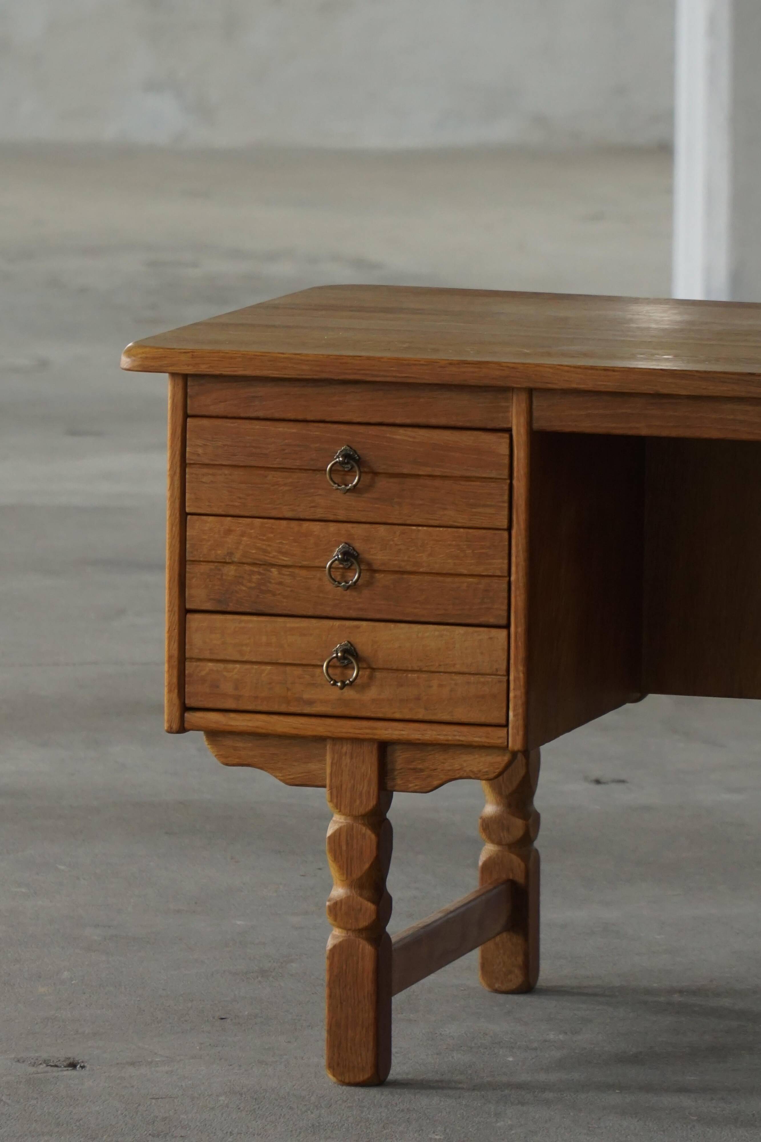 Free-standing desk in Oak by Henning Kjærnulf, Mid-century Danish Modern, 1950s.