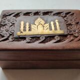 Old wooden box carved with flowers and brass