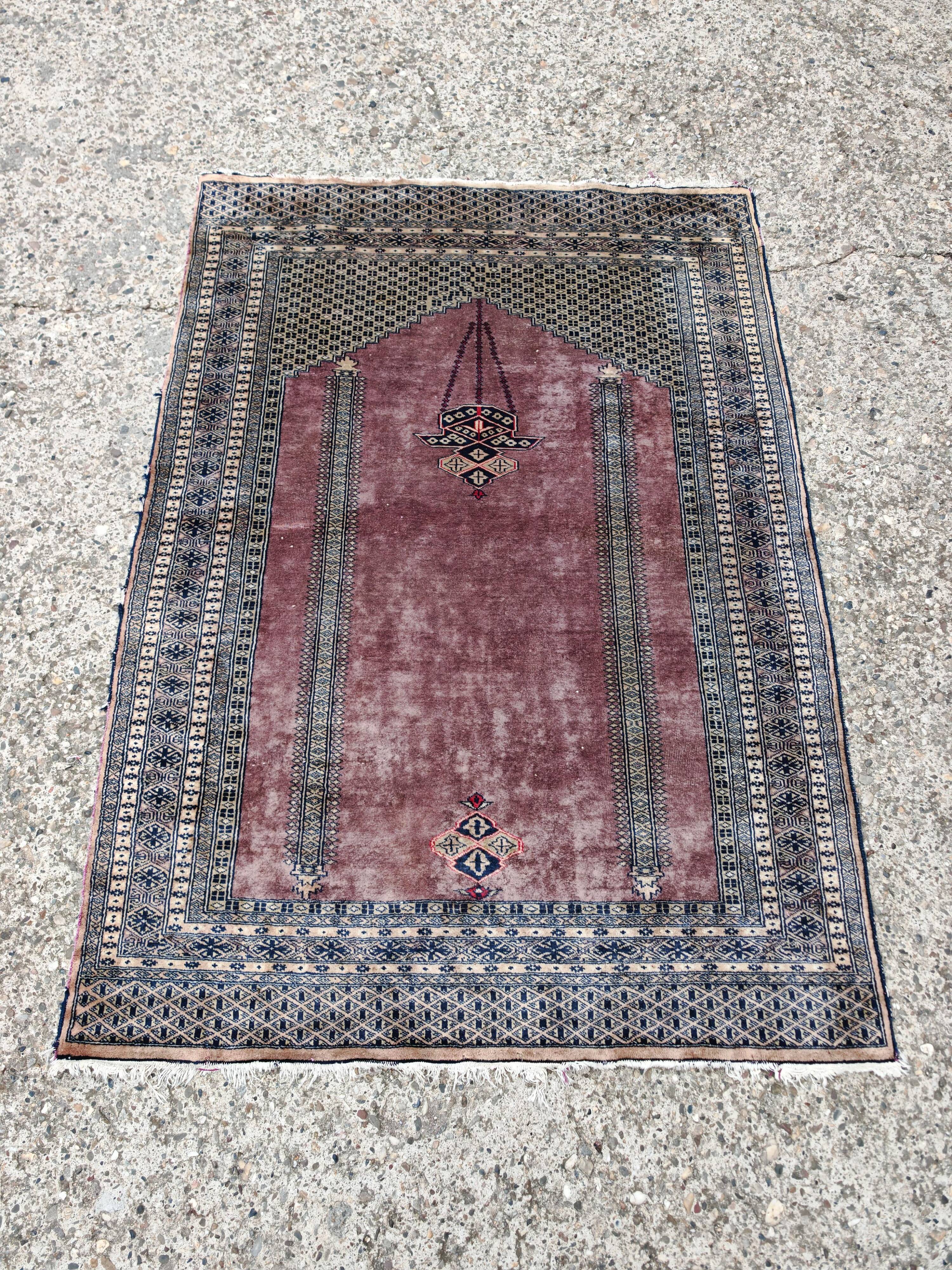Vintage Anatolian prayer rug made of hand-knotted wool.